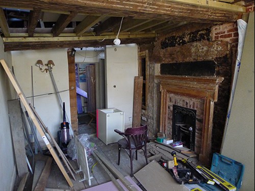 Image of fire loading and missing ceiling in one of the rooms