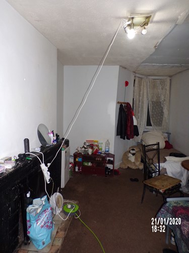 Photo of room 3 depicting the ceiling light connected via an extension lead