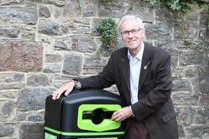 Cllr Colin Slade nest to a new recycle bin 