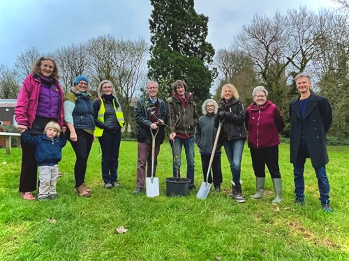 Pictured: Members of Tiverton Tree Team and Sustainable Tiverton, with Councillor Colin Slade, Cabinet Member for the Environment and Climate Change, and Jason Ball, Mid Devon Climate and Sustainability Specialist at the site of the orchard planting with a Cornish Gilli, apple tree.