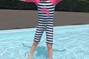 Child enjoying the paddling pool in Tiverton