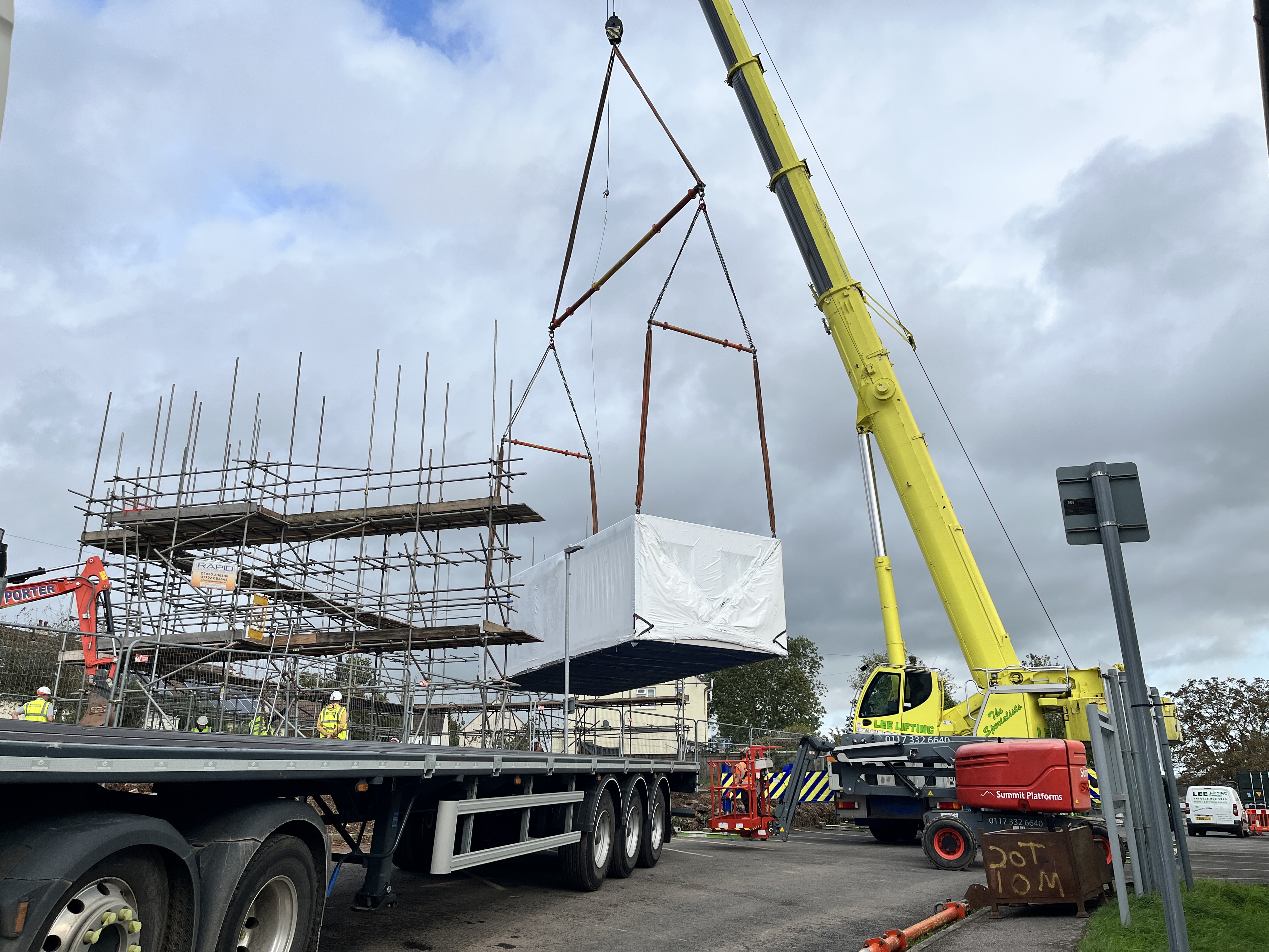 Pre-built homes arrive onsite as social housing development nears completion