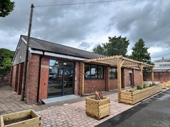 exterior of building with wooden pergola