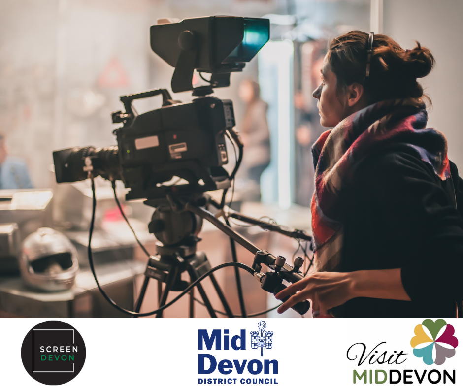 woman holding a tv camera and filming 