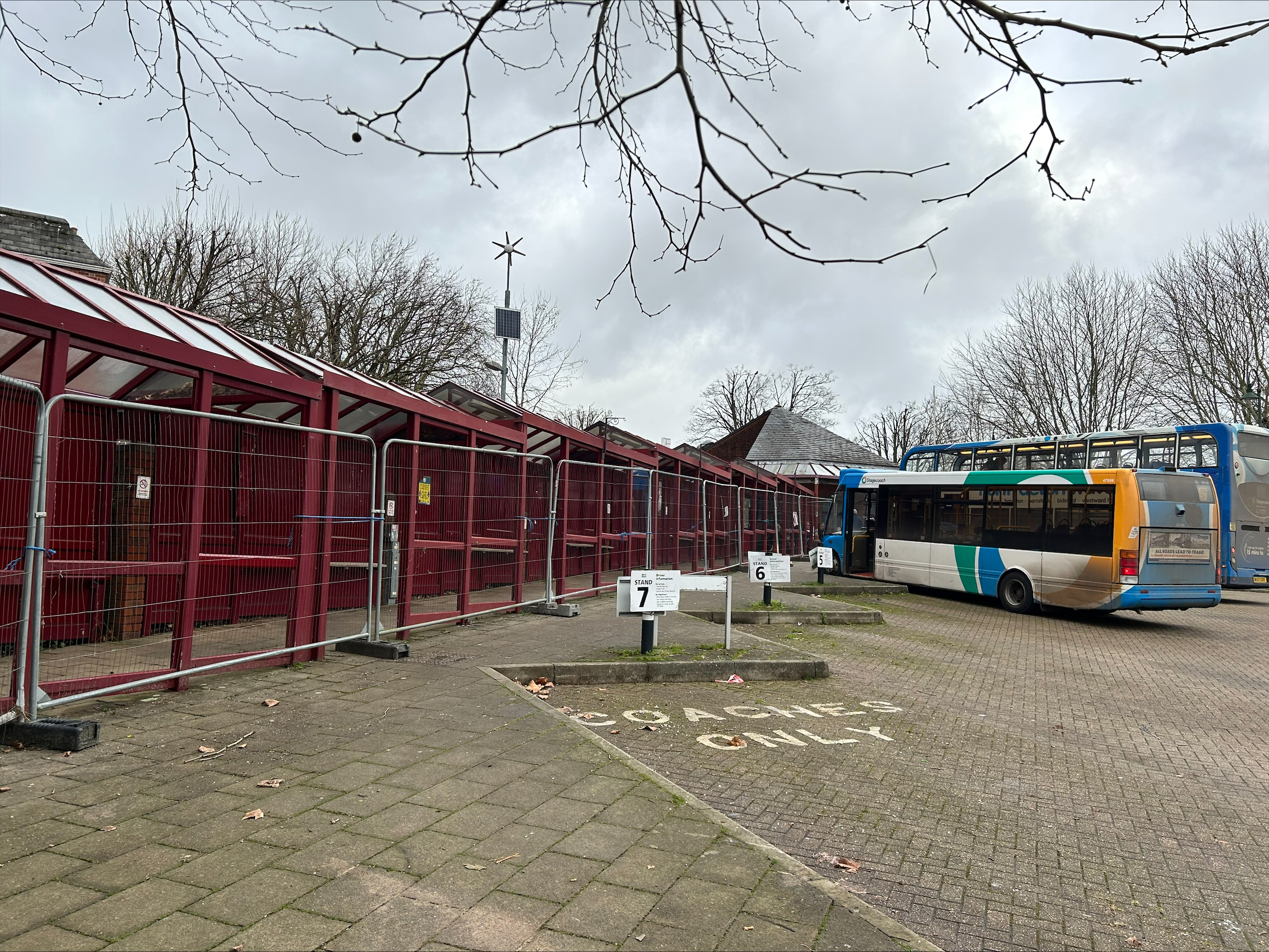 damaged bus shelters with hoarding 
