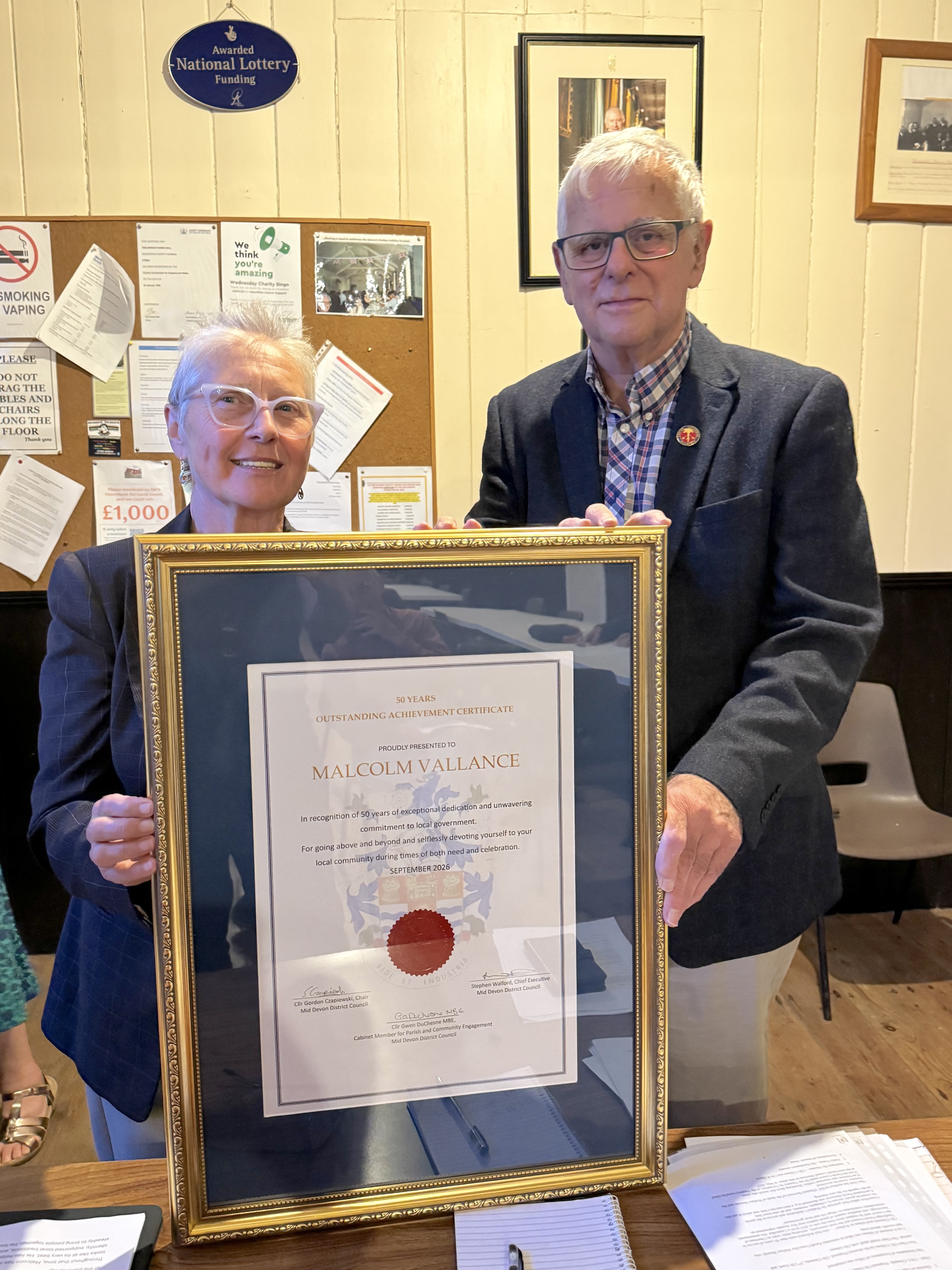 Cllr Duchesne with Malcolm Vallance and a framed certificate 